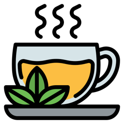 Steaming cup of tea with leaves and a saucer
